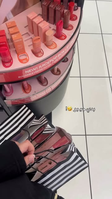 Colourful lip balms on a beauty display from a deer.girlll shopping reel